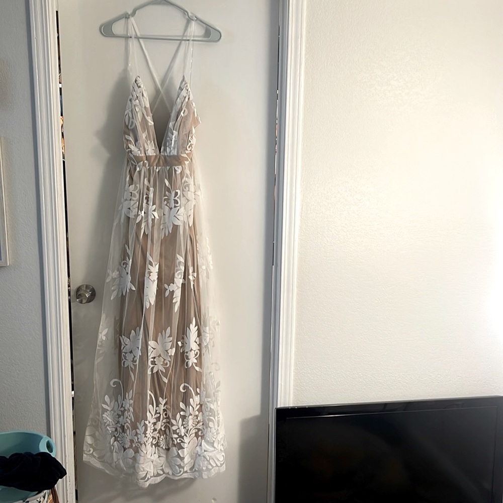 White and nude dress. I bought it off here and it didn’t fit. Fits like a M/L